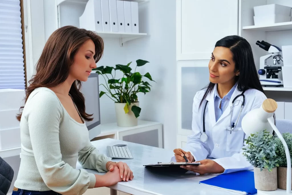 Person talking to a doctor, illustrating tips for managing a chronic illness effectively