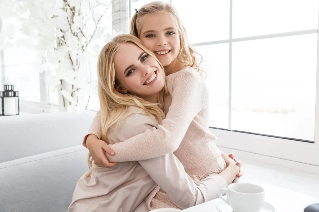 Mom hugging daughter, illustrating love, care, and family warmth for Stan’s Home Page