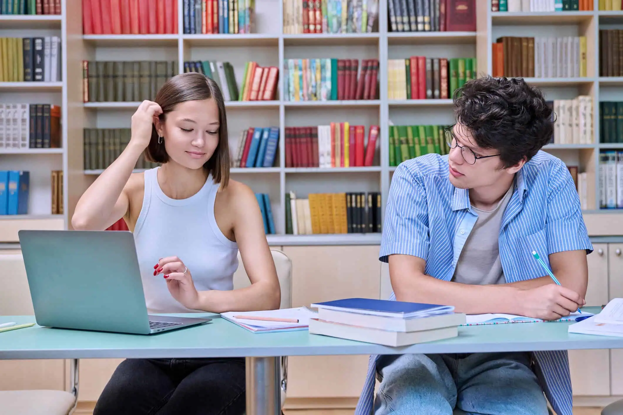 Two college students studying, illustrating strategies to manage exam stress effectively