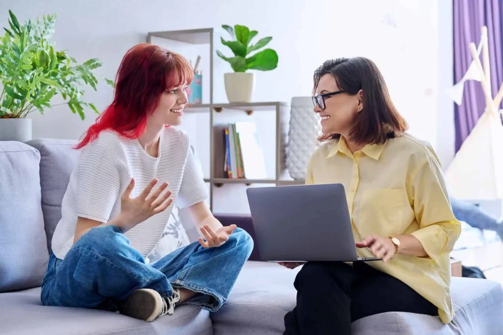 Girl talking to a counselor, illustrating how to find and connect with a good mental health professional
