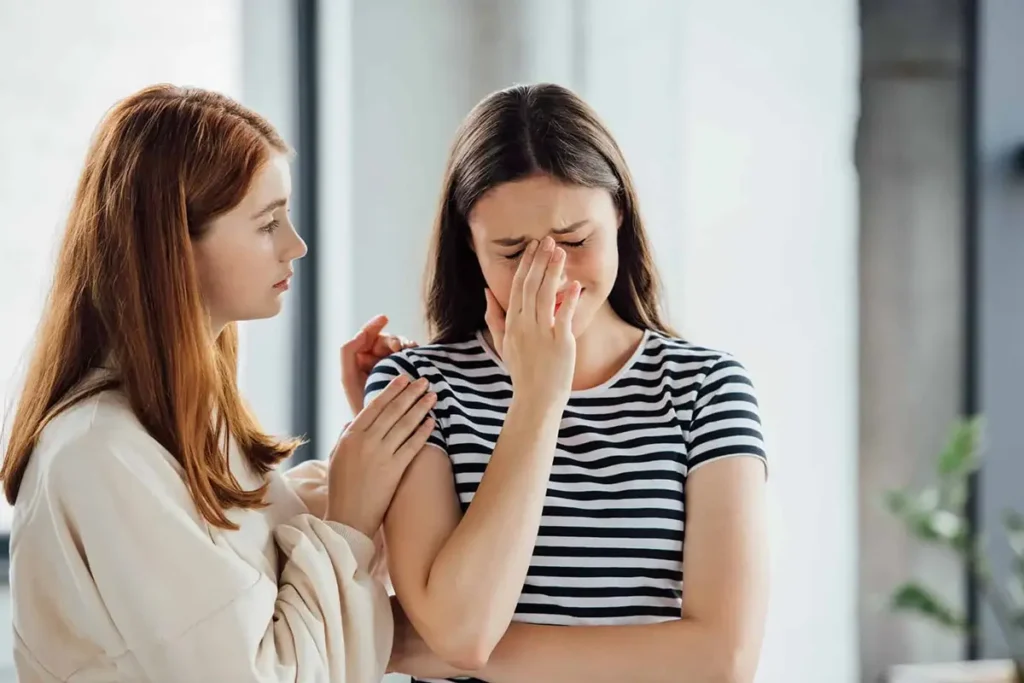 Girl supporting a sad friend, illustrating tips for managing depression effectively