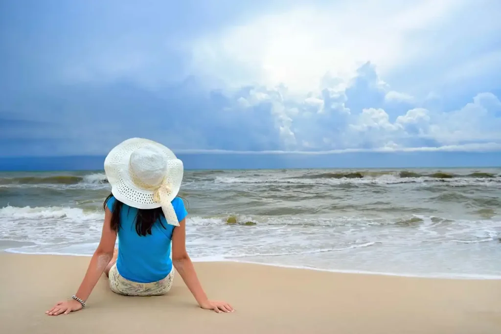 Woman looking out at ocean, illustrating tips for coping with panic attacks effectively